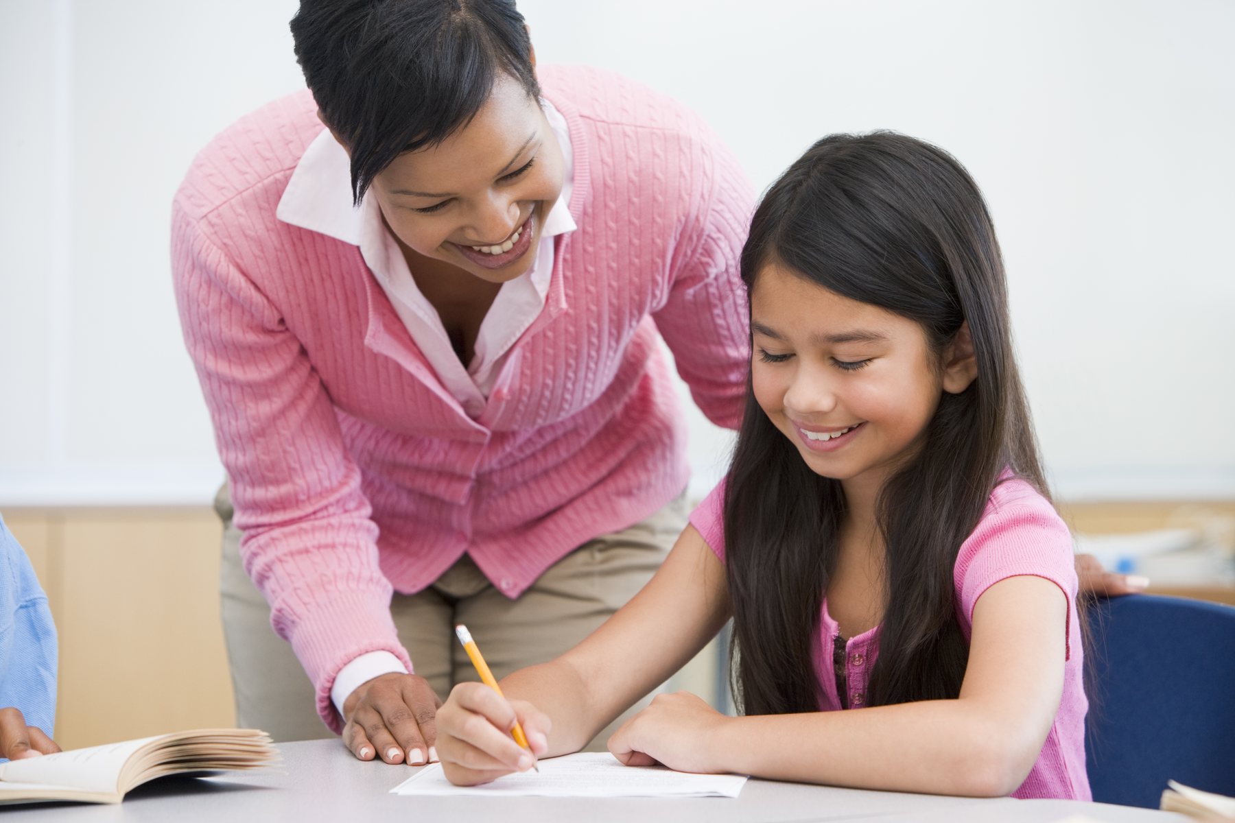 A supportive educator working individually with a student